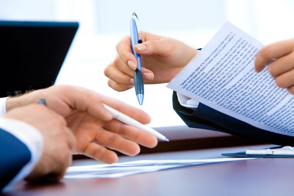 Professional office workers going through documents